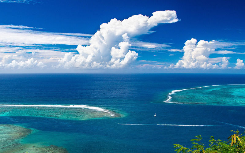 Pacific islands and sailboat