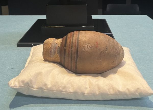 Terracotta vessel with incised linear detailing from classical period.