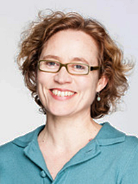 image of woman with red hair, glasses and aqua shirt
