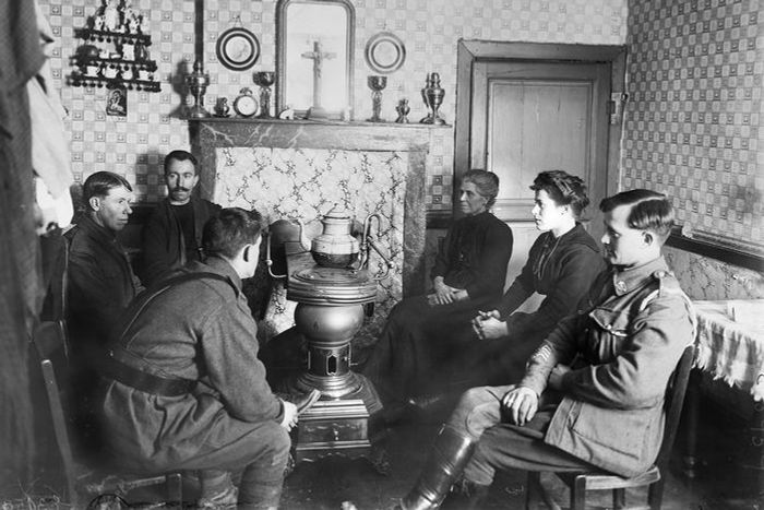 black and white photo of people in living room