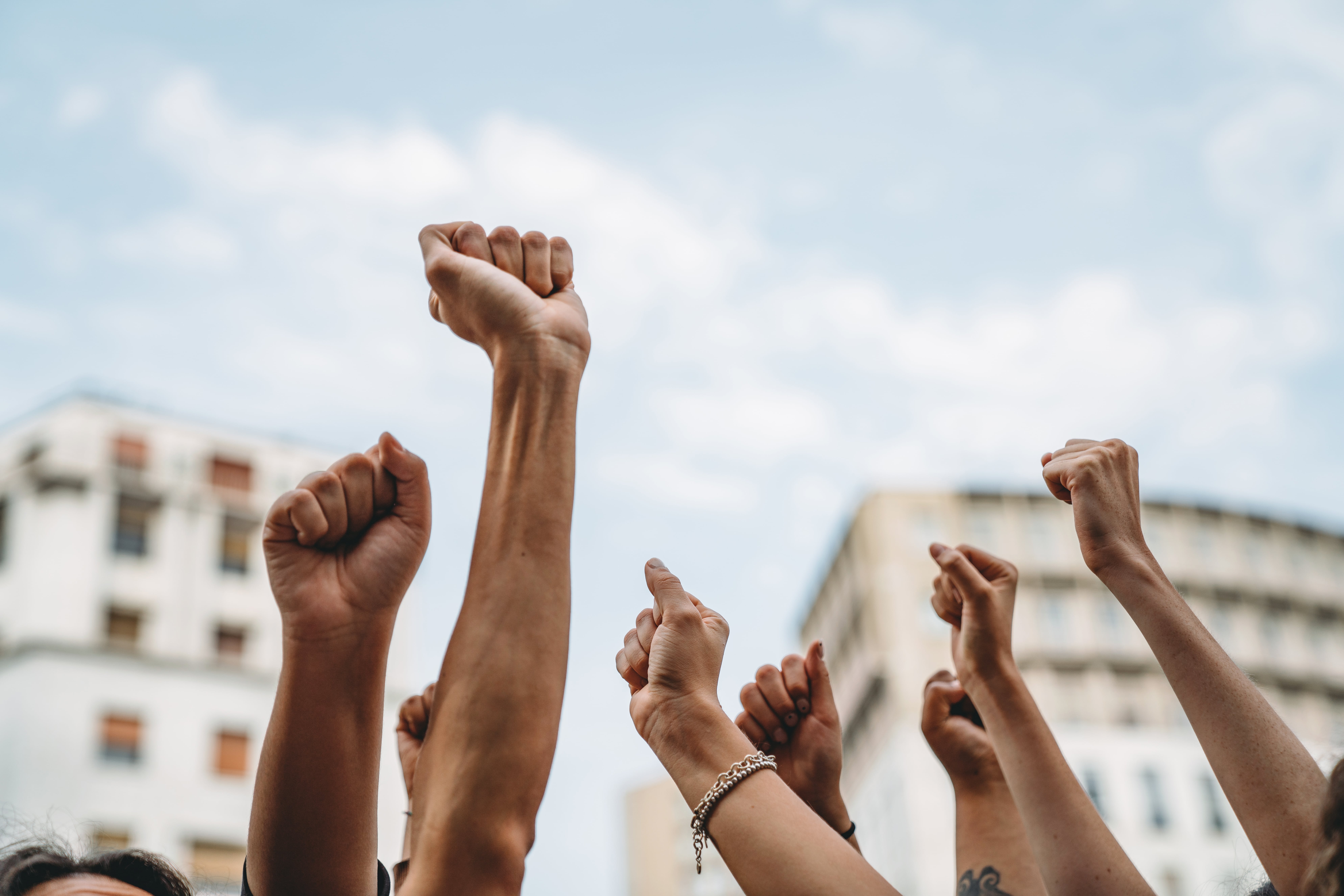 People raising their fists in solidarity