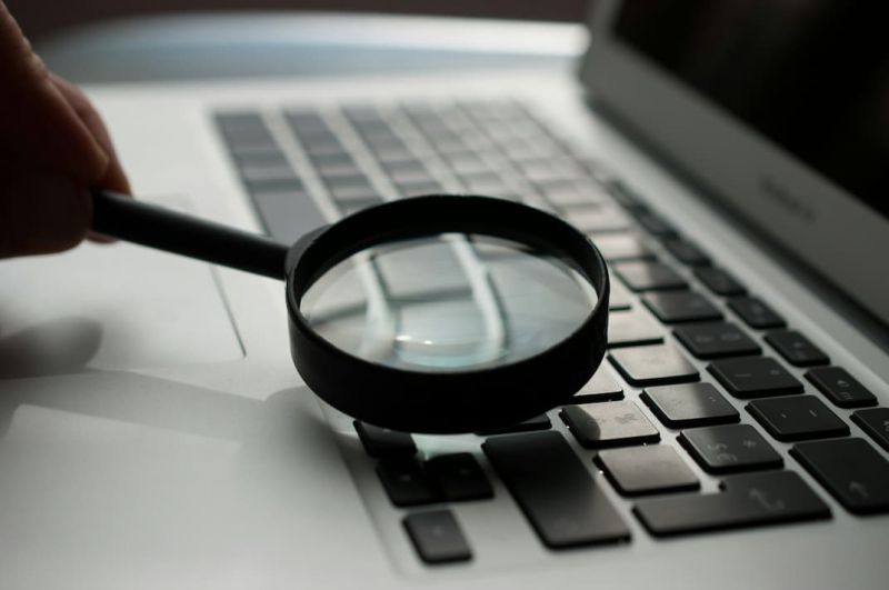 A magnifying glass on a computer