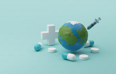 Capsules, tablets and syringe in earth against light green background