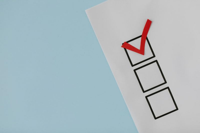 A white paper with a check mark on it