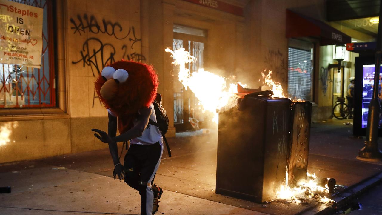 Rioter in elmo mask