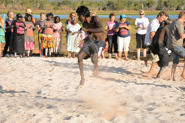 Toby Cooper dances at the Stone Country Festival, Gunbalanya, 2011. In the background, visitors learn to dance to Johnny Namayiwa’s Milyarryarr (Black Heron) song-set.