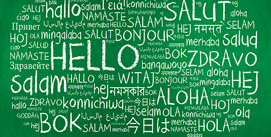 world cloud filled with hello written in different languages on green background