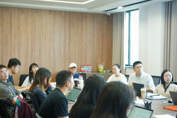 A group of people in a meeting