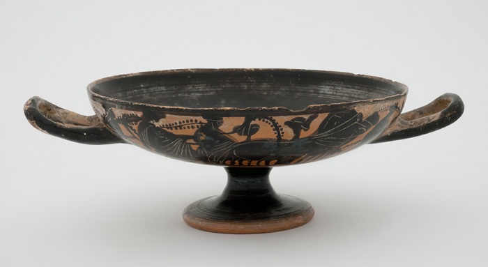 Attic black-figure kylix with Dionysiac procession on sides and satyr in tondo c. 500 BCE